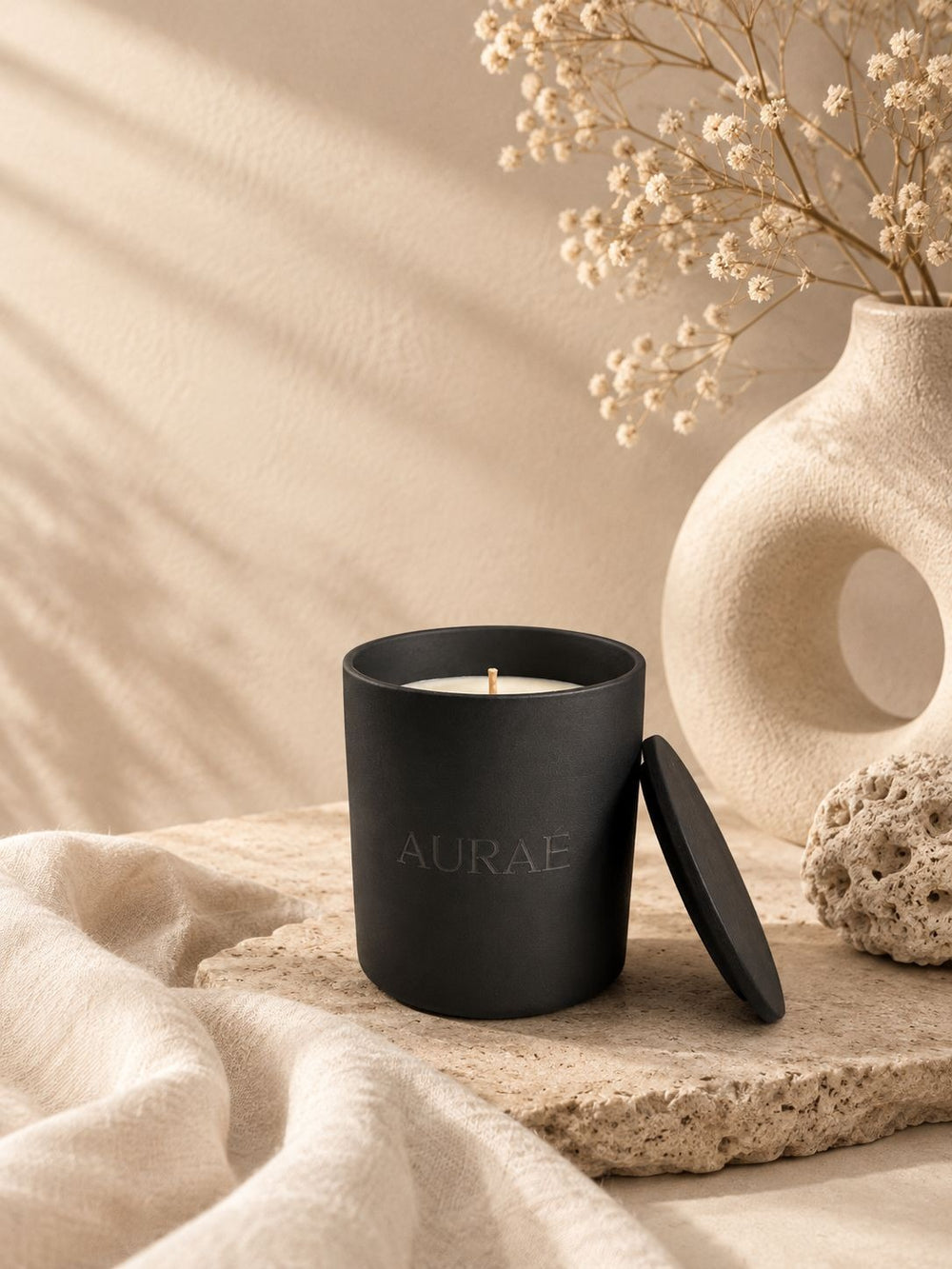 AURAÉ candle in a matte ceramic vessel